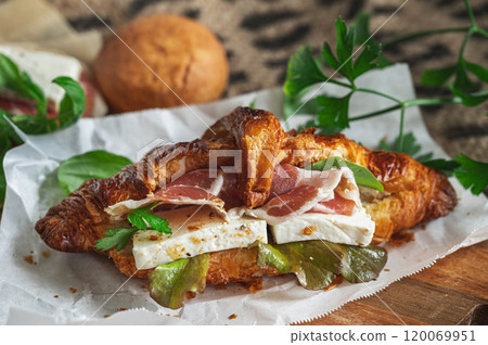 Prosciutto and tofu cheese croissant sandwich 120069951