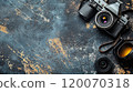 old style photo camera on abstract grey backgound, retro fashion photography concept, view from abobe, copy space 120070318