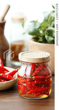 Red chili peppers in jar with herbs in kitchen setting for spicy culinary themes, AI Generative 120071558