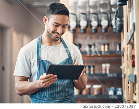 Small business, asian man and smile in cafe with tablet, product check and scroll for inventory management. Coffee shop, manager and barista with digital for stock quality, startup or online services 120072397