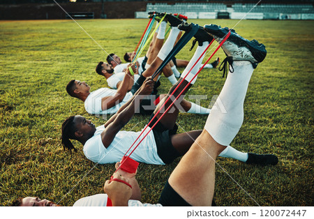 Its to increase muscular strength and endurance. Cropped shot of a group of young rugby players training with bands on the field during the day. Its to increase muscular strength and endurance. Cropped shot of a group of young rugby players training with bands on the field during the day. 120072447