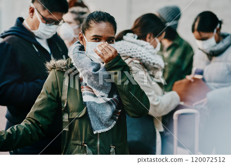 Coronavirus has gotten out of control. Shot of a group of young people wearing masks while travelling in a foreign city. 120072512