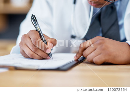 Updating his notes. Closeup shot of an unrecognisable doctor writing notes on a clipboard in an office. Updating his notes. Closeup shot of an unrecognisable doctor writing notes on a clipboard in an office. 120072564