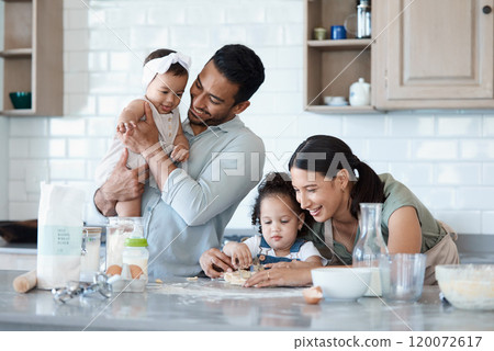 Happy family, children and baking with cookie cutter to shape dough, flour and carrying baby in kitchen. Mom, dad and kids cooking with parents, help and teaching dessert recipe for support in home 120072617