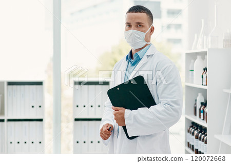 Lets get the world better again. Portrait of a confident young scientist wearing a mask in a modern laboratory. Lets get the world better again. Portrait of a confident young scientist wearing a mask in a modern laboratory. 120072668