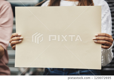 Its a matter of choice. Cropped shot of an unrecognizable woman holding a sign while taking part in a political rally. 120072695
