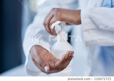 Deterring the spread of germs and illness-causing bacteria. Closeup shot of an unrecognisable doctor using hand sanitiser in a hospital. 120072725