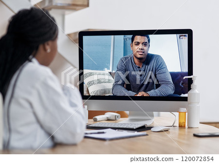 Save time and money by video calling your doctor. Shot of a young man having a video call with a doctor on a computer. 120072854
