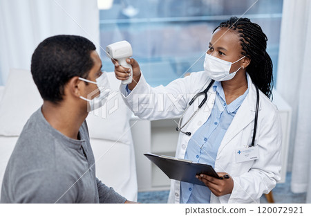 A fever could be the first sign of an infection. Shot of a doctor taking a patients temperature with an infrared thermometer. A fever could be the first sign of an infection. Shot of a doctor taking a patients temperature with an infrared thermometer. 120072921