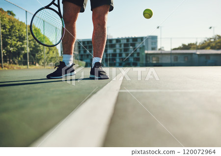 If you dont practice, you wont win. Closeup shot of an unrecognisable man playing tennis on a tennis court. 120072964