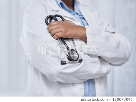 Doctors play a critical role in improving the standards of healthcare. Closeup shot of an unrecognisable doctor holding a stethoscope in a hospital. 120073045