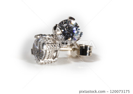 Diamond earrings. Big diamond earrings, large solitaire earrings on white background. Diamond earrings. Big diamond earrings, large solitaire earrings on white background. 120073175