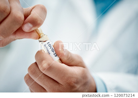 Just what the world has been waiting for. Cropped shot of a scientist opening an ampoule with 2019-nCov on it. 120073214