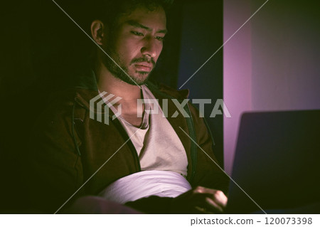Night, laptop and anxiety with man in bedroom for cyber bullying, doxxing and mental health. Depression, online stalker fear and trauma with person in home for schizophrenia, stress and insomnia 120073398