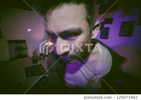 Home, night and asian man with mental disorder for depression, anxiety and upset with neon light. Confusion, male person and sad with insomnia for schizophrenia, bipolar and paranoid in apartment 120073462