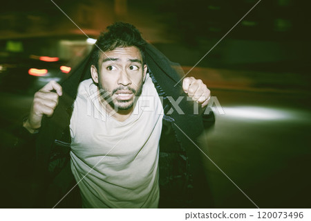 Fear, scared and man in city, night and paranoid schizophrenia with mental health. Person, outdoor and guy in street, New York and illness with hallucination, evening and anxiety with drug abuse 120073496