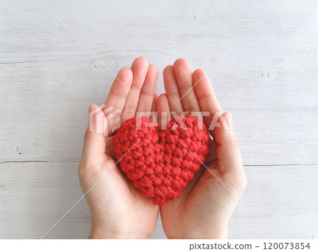 Woman's hand with a heart Woman's hand with a heart 120073854