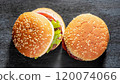 macro photo of three hamburgers on black kitchen granite surface top view 120074066