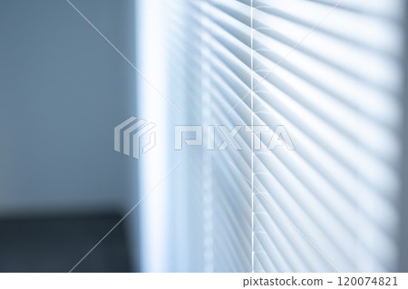 Light shining through blinds 120074821