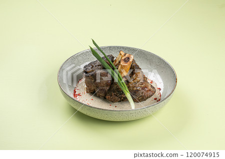 Portion of baked beef shank with pepper sauce Portion of baked beef shank with pepper sauce 120074915