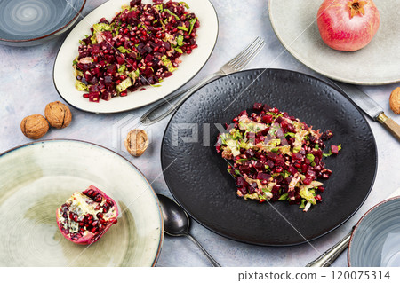 Beetroot pomegranate salad with nuts Beetroot pomegranate salad with nuts 120075314