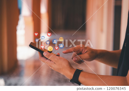Man with smartphone showing social media likes, concept of online network connection digital technology communication interaction. 120076345