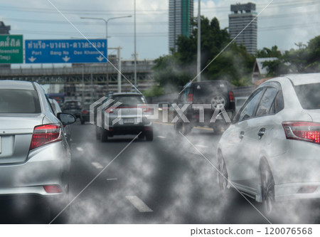 Air pollution from car exhaust smoke traffic in the city. Reducing global warming pollution and carbon dioxide from engine combustion. 120076568