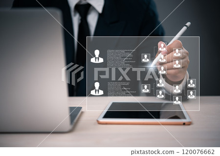 business professional using a digital pen to interact with an organizational chart displayed on a digital interface, representing team management and corporate structure. Human resources, management, 120076662