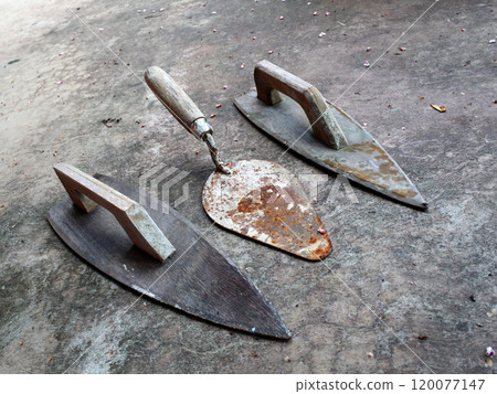 Wooden shoes and cement spoons Wooden shoes and cement spoons 120077147