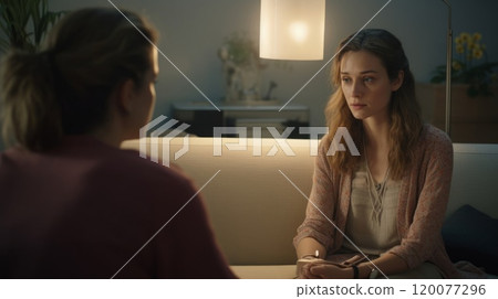 Visit to a psychologist. Woman sits on a couch and talks to a psychotherapist. 120077296