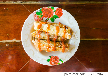 Spring rolls and sauces 120079678