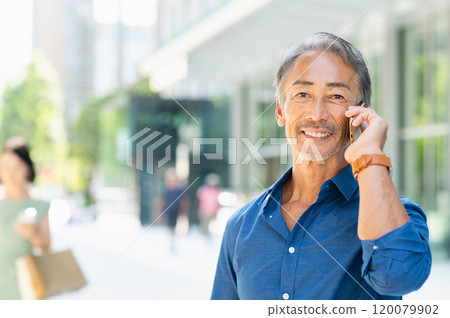 Senior man calling with a smile Senior man calling with a smile 120079902