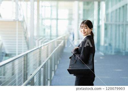 Young woman in a suit Young woman in a suit 120079903