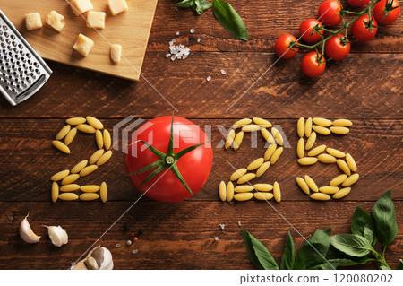 2025 figures with Italian ingredients on a rustic wooden background, tomatoes, pasta, basil and parmesan 120080202