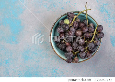 ripe black grapes on plate with copy space. ripe black grapes on plate with copy space. 120080738
