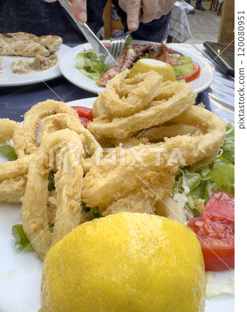 delicious fried calamari, seafood on table 120080951