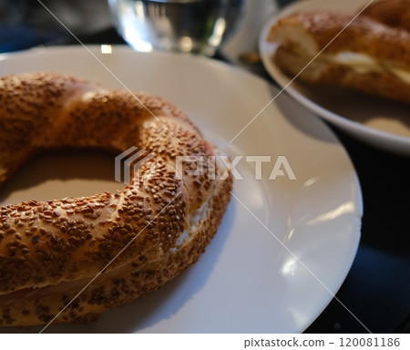 Freshly Baked and Golden Brown Simit with Delicious Sesame Seeds on Beautiful Plate 120081186