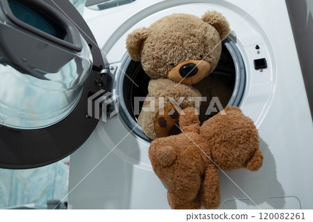 Adorable Teddy Bears Taking a Spin in the Washing Machine, Ready to Get Clean and Fresh Adorable Teddy Bears Taking a Spin in the Washing Machine, Ready to Get Clean and Fresh 120082261