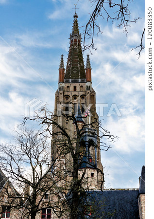 Vertical shot, bruges, belgium, view of the tower of the church of our lady Vertical shot, bruges, belgium, view of the tower of the church of our lady 120083350