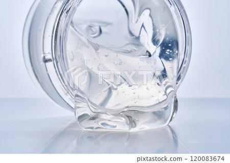 Texture of the gel in the jar. Hair gel or hyaluronic gel for the face. Texture of the gel in the jar. Hair gel or hyaluronic gel for the face. 120083674