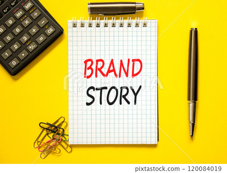 Brand story branding symbol. Concept words Brand story on beautiful white note. Beautiful yellow paper background. Black calculator. Business brand story branding concept. Copy space. 120084019