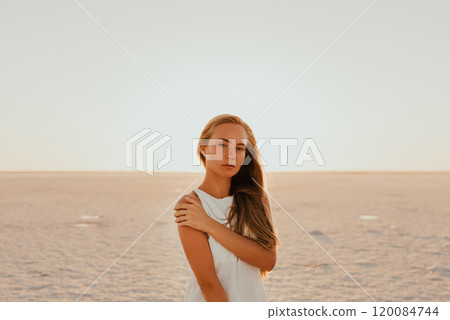 portrait of young tanned blonde European woman 120084744