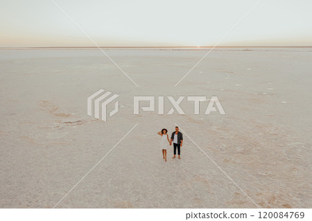 pink Lemurian lake, romantic photoshoot of young couple in love 120084769