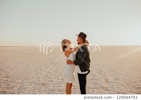 pink Lemurian lake, romantic photoshoot of young couple in love 120084781