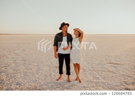 pink Lemurian lake, romantic photoshoot of young couple in love 120084785