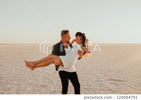 pink Lemurian lake, romantic photoshoot of young couple in love 120084791