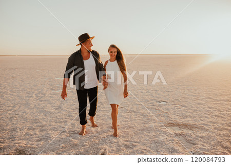 pink Lemurian lake, romantic photoshoot of young couple in love pink Lemurian lake, romantic photoshoot of young couple in love 120084793