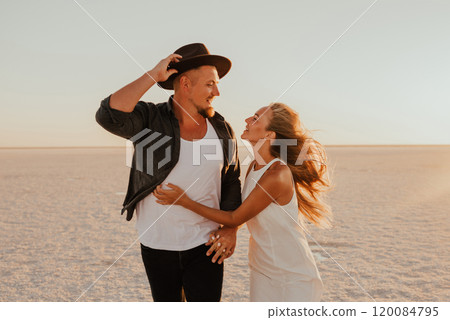 pink Lemurian lake, romantic photoshoot of young couple in love 120084795