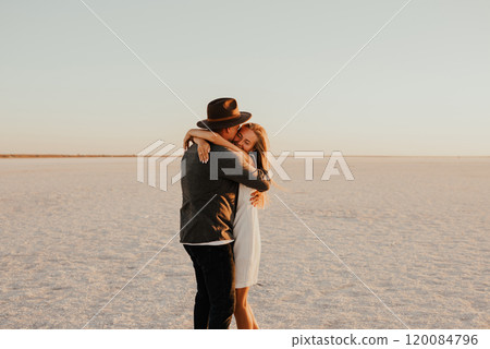 pink Lemurian lake, romantic photoshoot of young couple in love 120084796