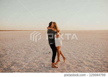 pink Lemurian lake, romantic photoshoot of young couple in love 120084799